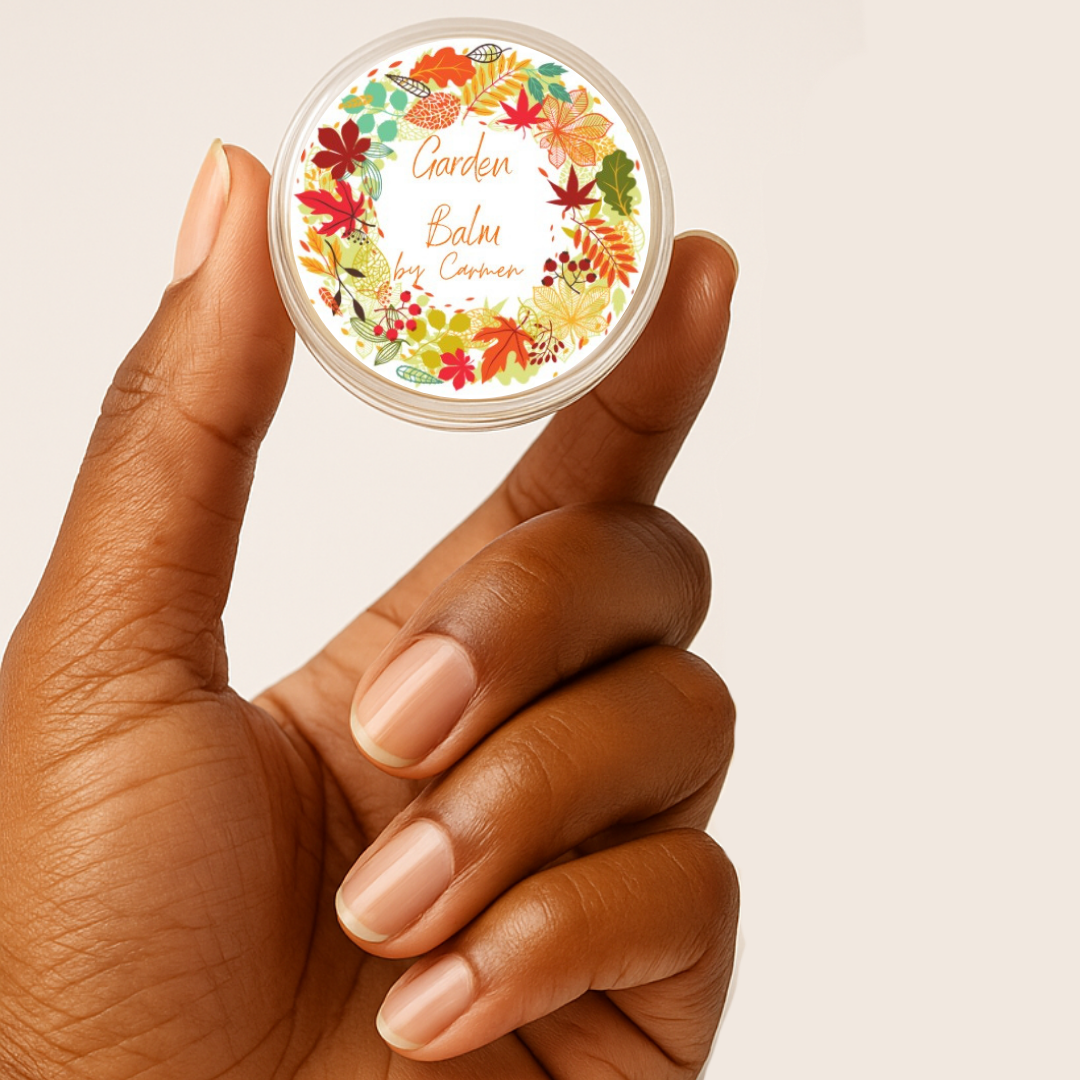 Hand holding a small container with a colorful label on a beige background